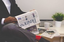 man reading a business publication